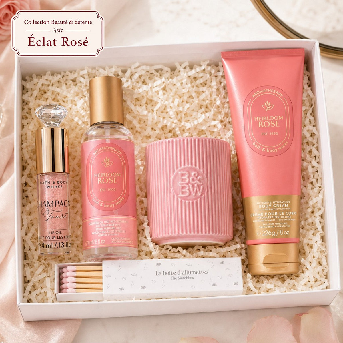 Coffret cadeau beauté Éclat Rosé avec soins Heirloom Rose, bougie rose, huile pour les lèvres Champagne Toast et allumettes rose pâle.